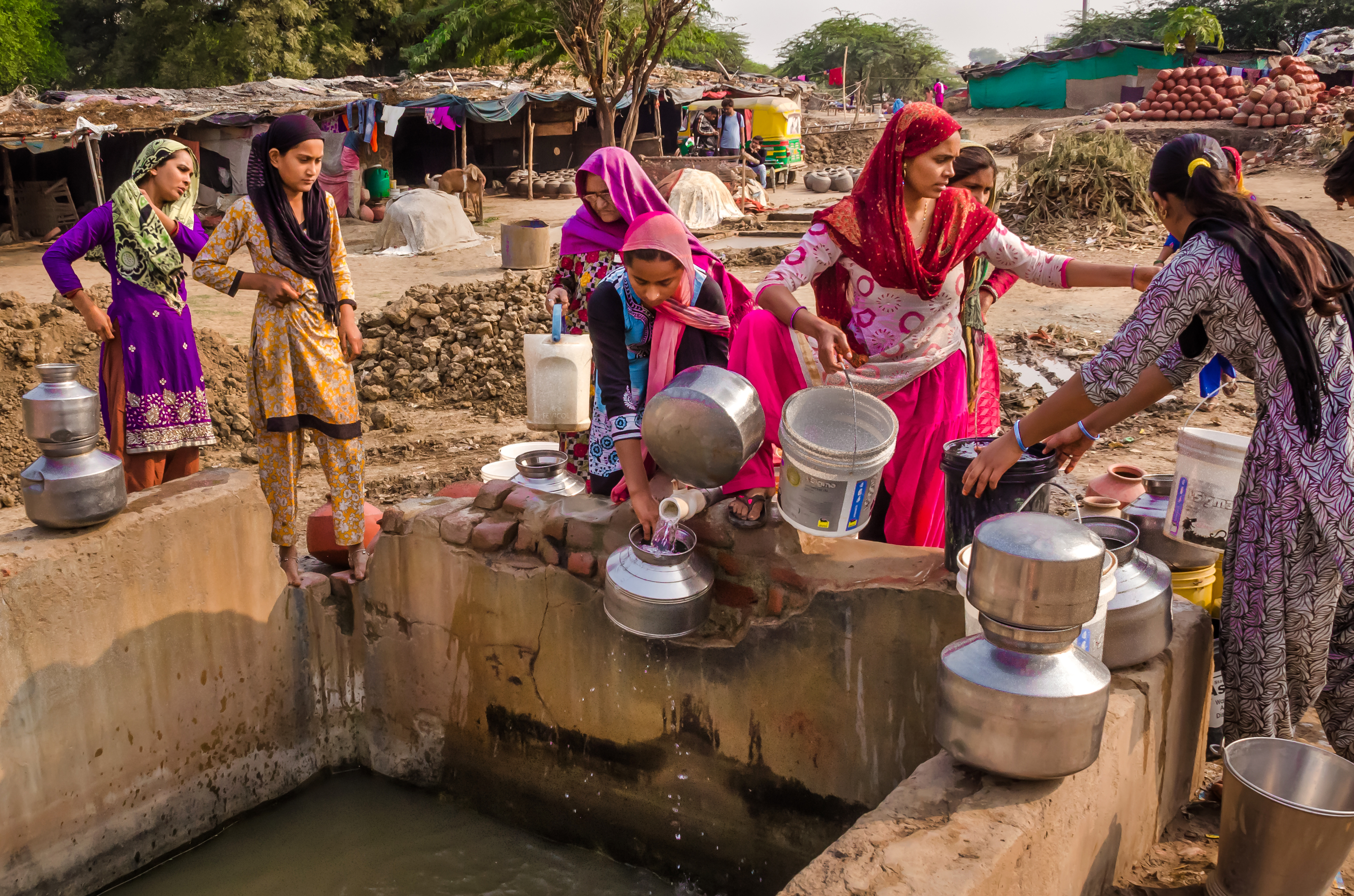 Women filling water from a pump