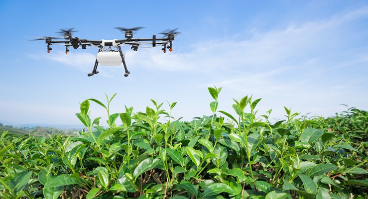 Drone flying over a field