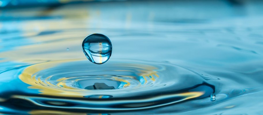 Droplet of water over a water body