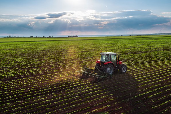 Tractor ploughing a large field