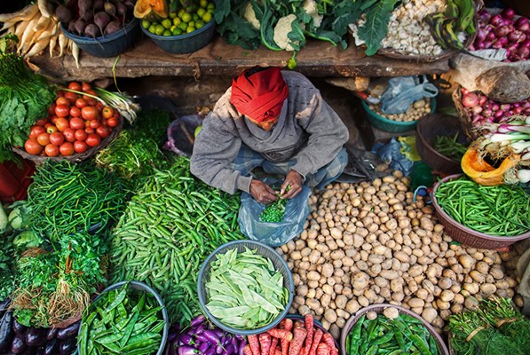Farmer with vegetables in a market