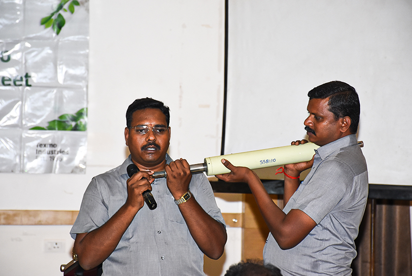 Taro Pumps sales manager explaining Taro Pumps products to mechanics