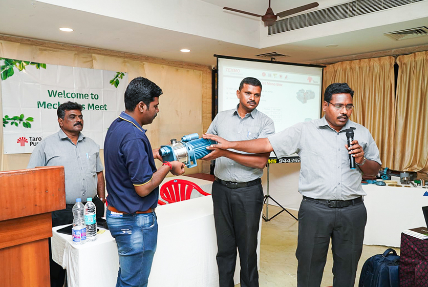 Taro Pumps sales manager explaining Taro Pumps products to mechanics