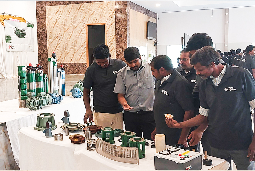 Taro Pumps sales manager explaining Taro Pumps products to mechanics