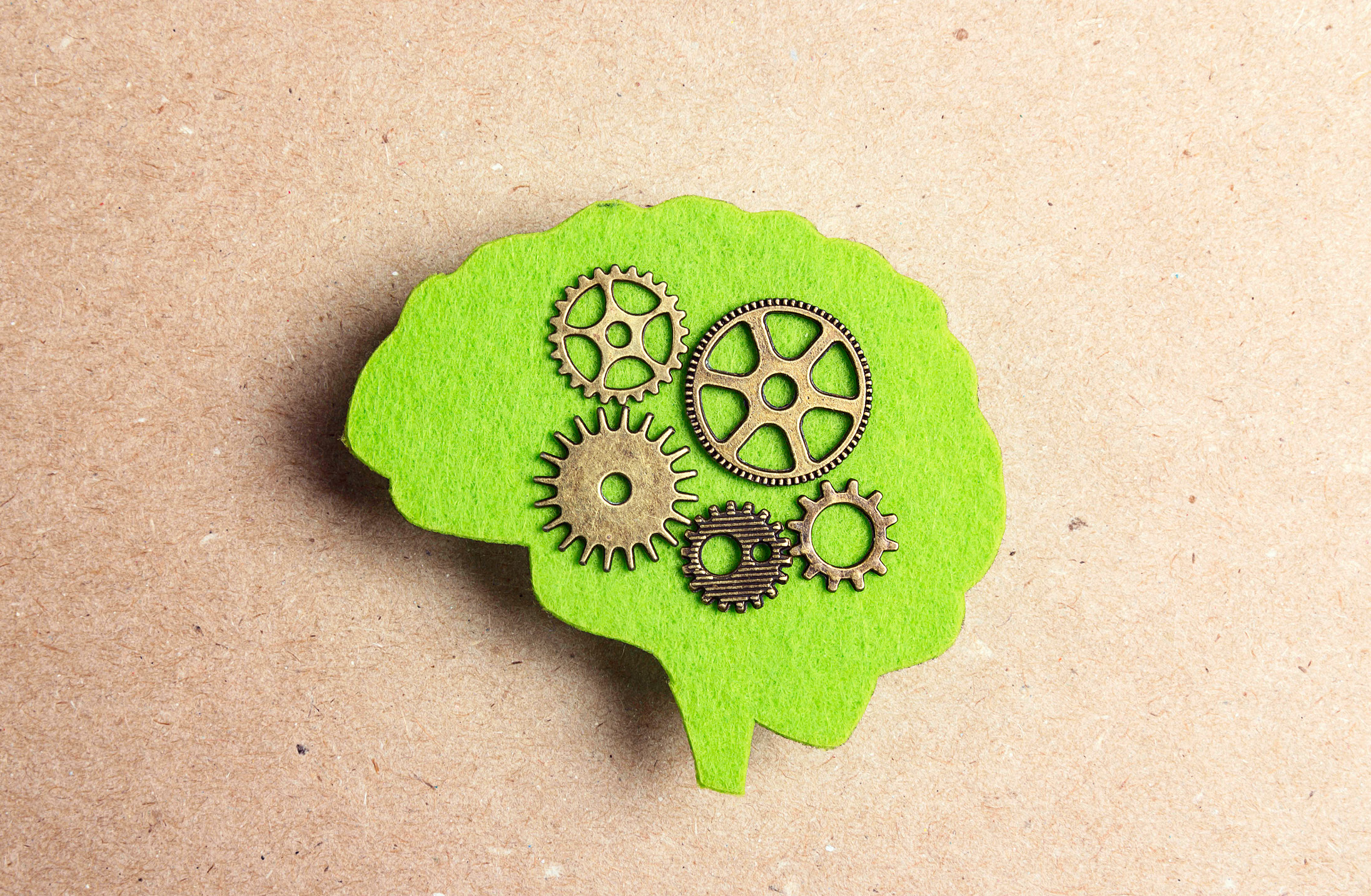 Pictograph of human brain with machine parts inside