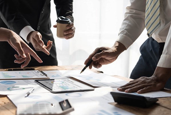 Business people reviewing the company documents