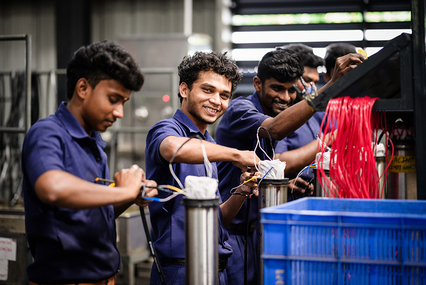 Taro Pumps engineers working in the factory