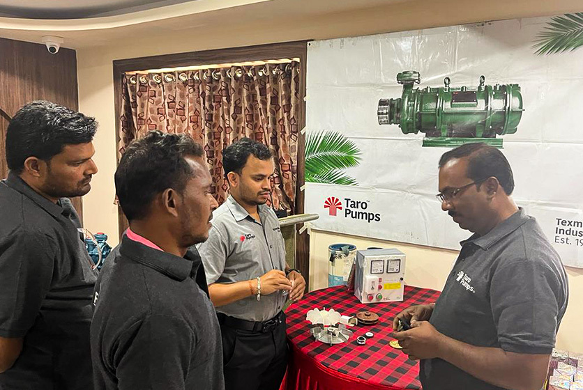 Taro Pumps manager explaining Taro Pumps products to mechanics