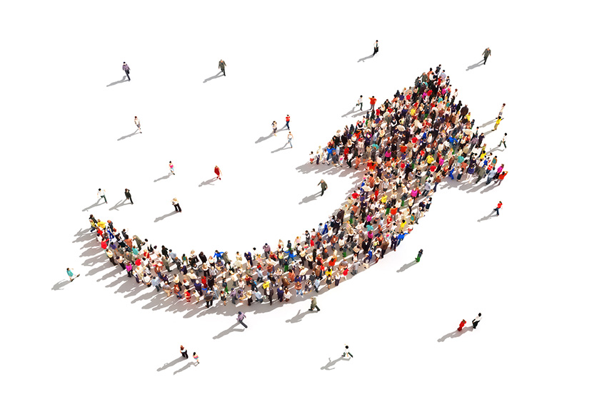 Large group of people illustrated in an arrow shape