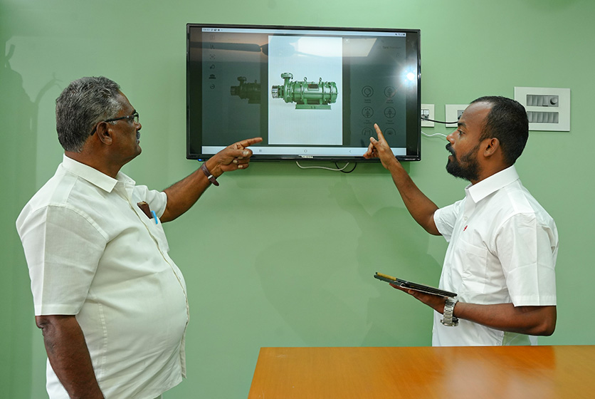 Taro Pumps manager explaining Taro Pumps products to dealers