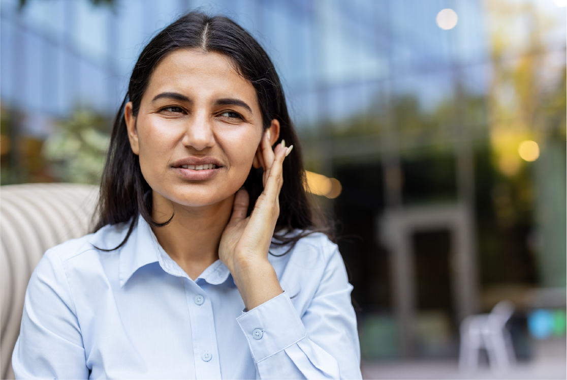 Woman experiencing earache, suffering from pain and discomfort